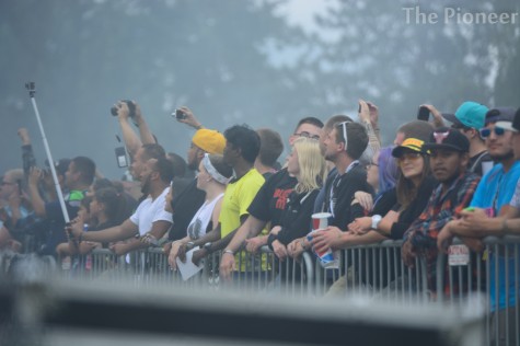 Onlookers watch from behind the safety fence. 