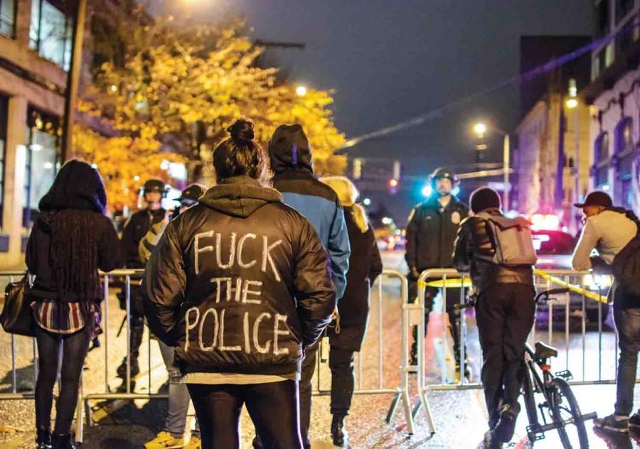 Protestors and police face off at 12th and Pike in Seattle. Anger and disbelief can be felt among the protestors.