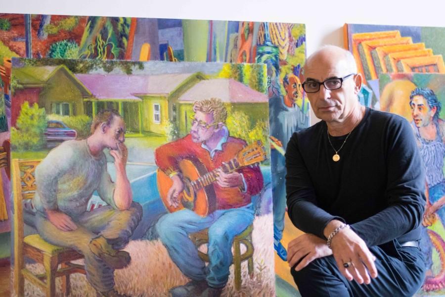 Barlow Palminteri sits next to his piece, "The Philosophers," based on memories from his life and past.
