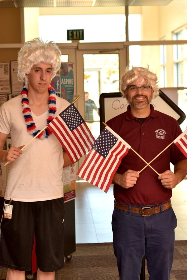 Two men with wigs and American flags