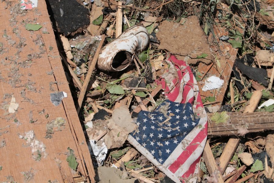 American flag, shoe, and ruins