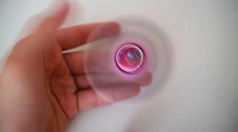 A fidget spinner in motion