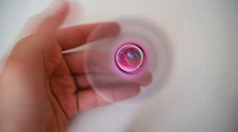 A fidget spinner in motion