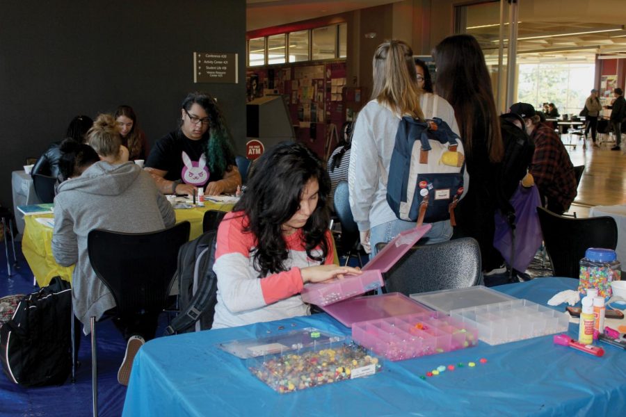 Sonia Diaz choses beads for her art project.