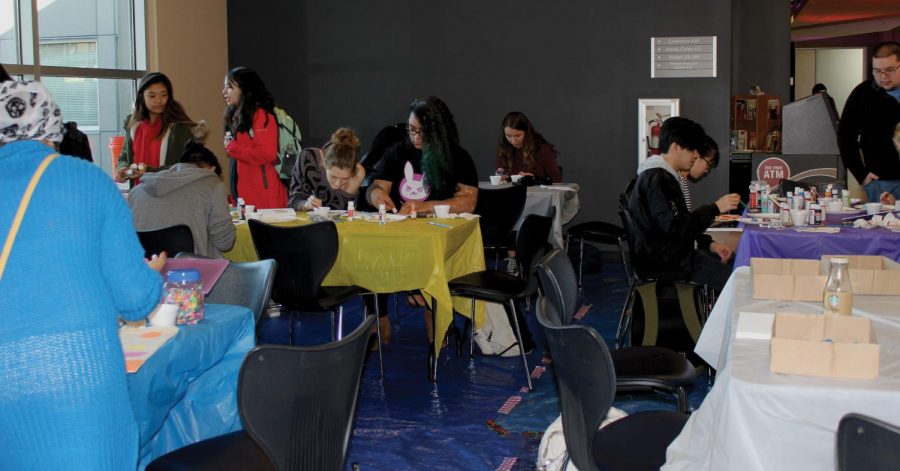 There were several tables with different kinds of arts and crafts projects that students could do.