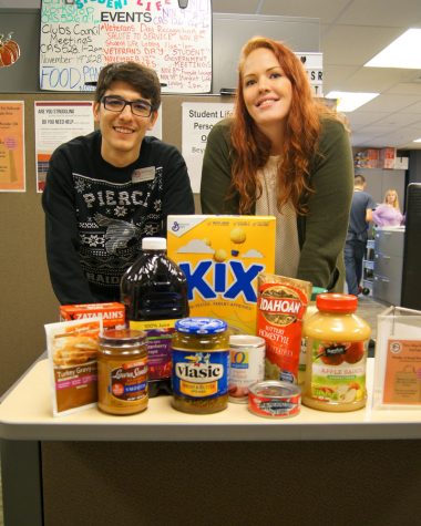 Student Life staff poses with some food donations.