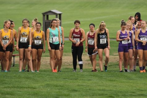 Ready, set, go!  #132 Serin Caldwell (left) and #133 Tiffany Compton(right)  Line       up at the  satring line  moments before the first race in the Pierce College’s 	
Womens Cross  Country history.