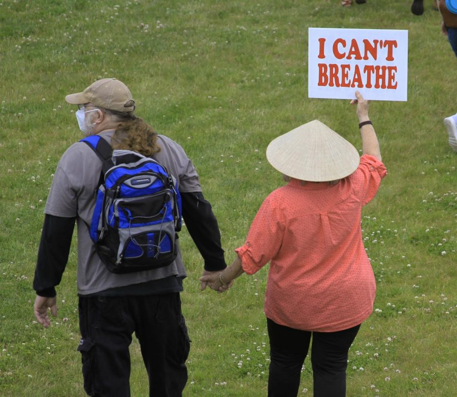 An elderly couple attending the protest.