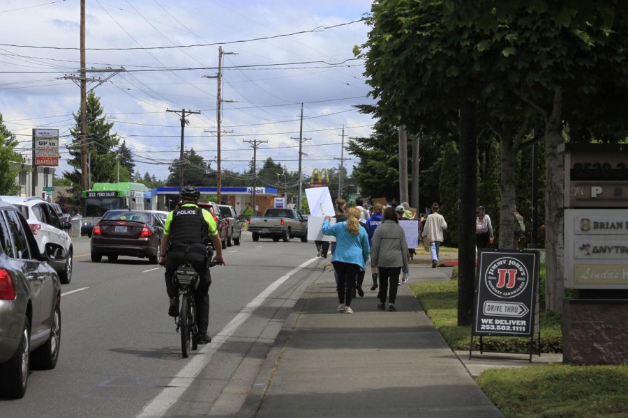 Lakewood bike police following protestors.