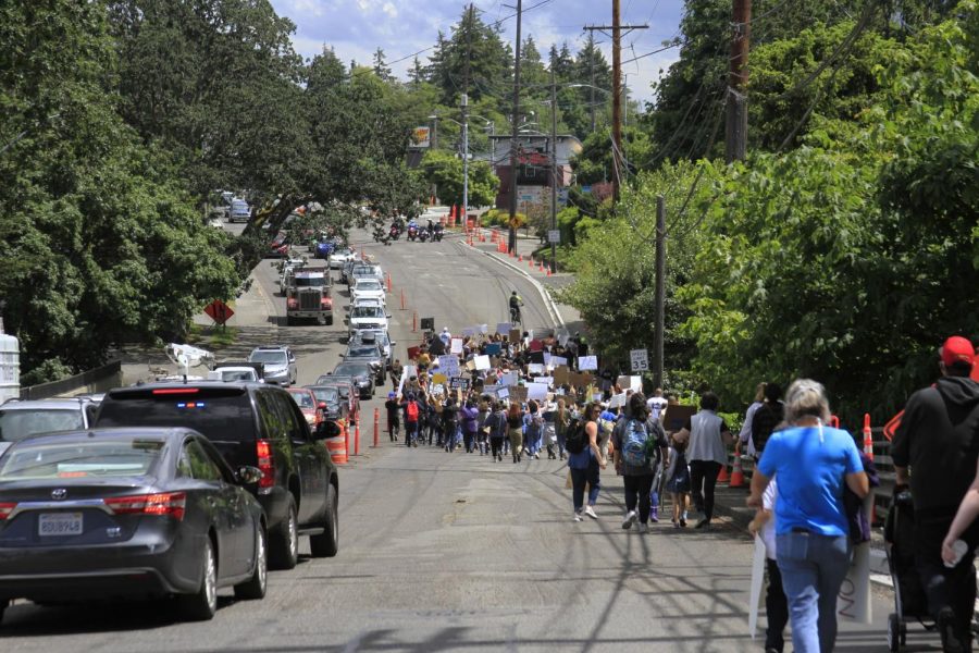 Protestors passing over Chambers Creek.
