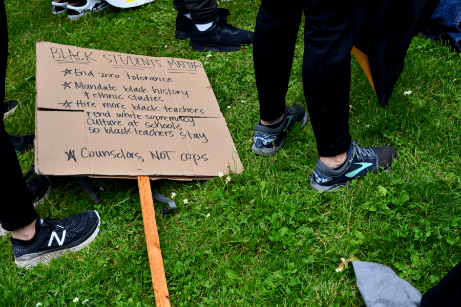 Many of the audience laid their signs down while listening to the speakers.
