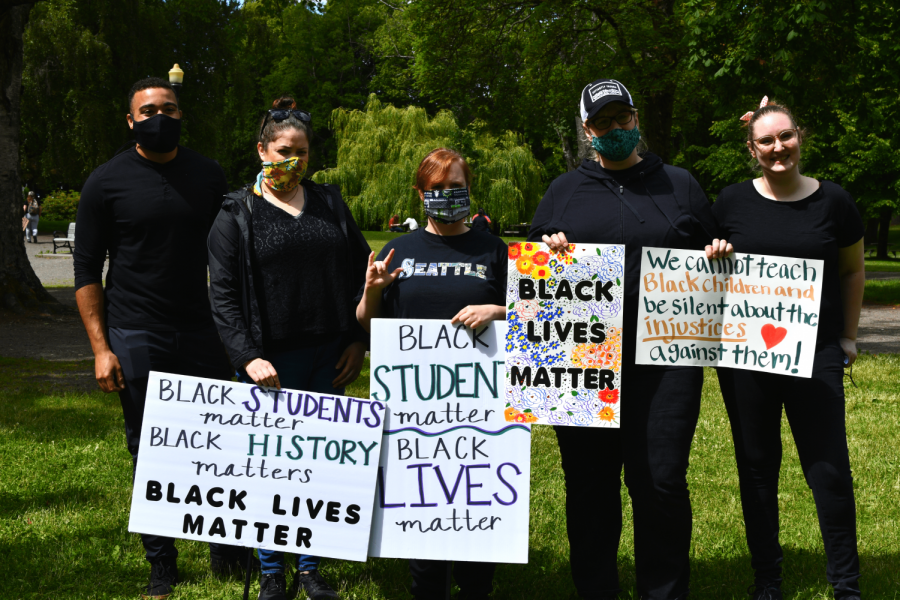 American signers (far left and far right) helped to transcribe every speaker at the protest to the individuals in the middle.